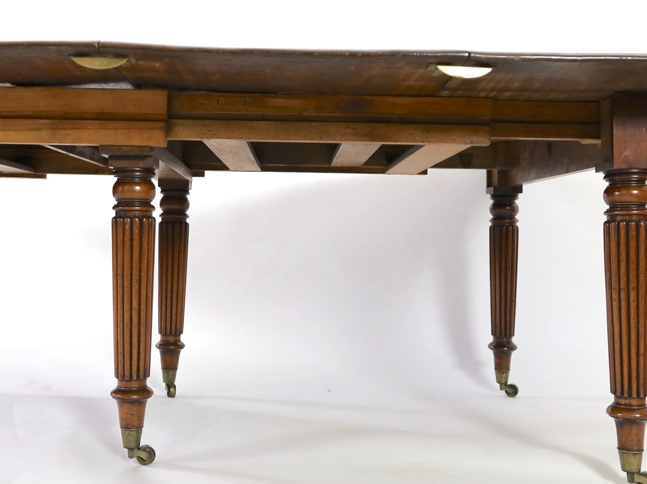 A Regency mahogany extending dining table, extends to 306cm x 135cm H.72cm